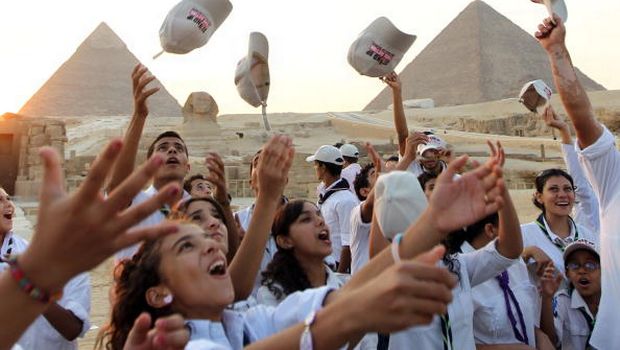 Egyptian youth take part in the 2010 'Stand Up, Take Action' campaign against poverty near the great pyramids of Giza on the outskirts of Cairo, on September 17, 2010.