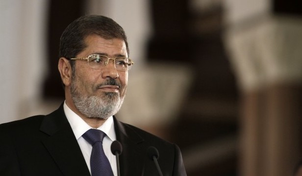 In this Friday, July 13, 2012 photo, Egyptian President Mohammed Morsi holds a joint news conference with Tunisian President Moncef Marzouki, unseen, at the Presidential palace in Cairo, Egypt. Egypt's Islamist president may look like he's running out of options as he faces an appeals court strike and massive opposition protests over decrees granting himself near absolute power. Will he back down now? Most likely not. Mohammed Morsi's next move may be to raise the stakes even higher. Signs are growing the constitutional panel at the heart of the showdown could vote on a draft this week despite a walkout by liberal and Christian members. (AP Photo/Maya Alleruzzo)