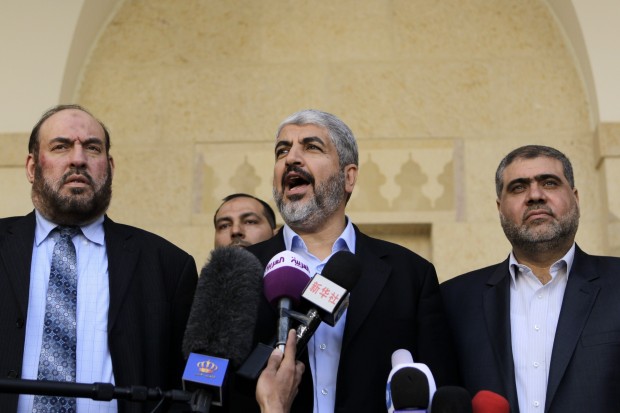 Hamas chief Khaled Meshaal (C) and members of Hamas' political bureau, Mohammed Nazzal (L) and Mohammed Nasser (R) speak to reporters flowing their meeting with Jordan's King Abdullah II at the royal palace in Amman on January 28, 2013. Hamas chief is holding talks with Jordan's King over Palestinian reconciliation efforts. AFP PHOTO/KHALIL MAZRAAWI