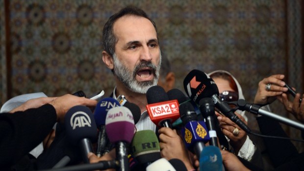 Ahmed Moaz al-Khatib, President of the National Coalition for Syrian Revolutionary and Opposition Forces, talks to the press following his meeting with Arab League Secretary General Nabil al-Arabi (not seen) in the League headquarters in Cairo on February 11, 2013. AFP PHOTO / KHALED DESOUKI