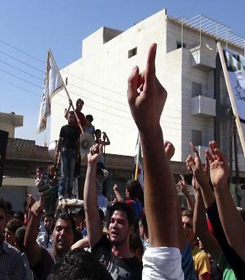 Demonstrators protest against Syria's President Bashar al-Assad after Friday prayers in Binsh. (R)
