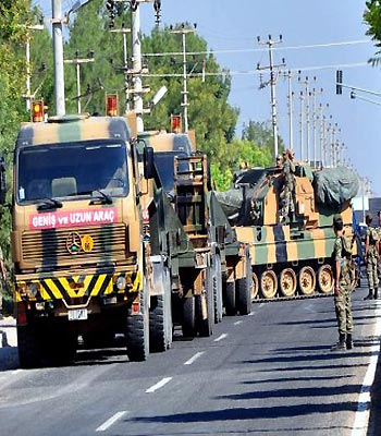 Turkey's military deployed armored vehicles and heavy weaponry to the border with Syria. (EPA)