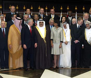 Foreign ministers and officials from industrialized nations and Arab states pose for a picture 12 November 2005 during the Forum for the Future, in Manama.(AFP)