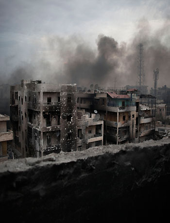 In this Tuesday, Oct. 2, 2012 file photo, smoke rises over Saif Al Dawla district, in Aleppo, Syria. (AP)