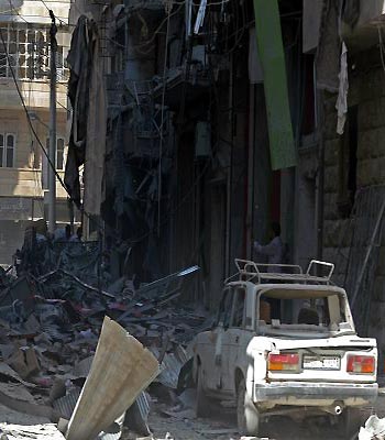 Syrians inspect destruction in the northern city of Aleppo. (AFP)