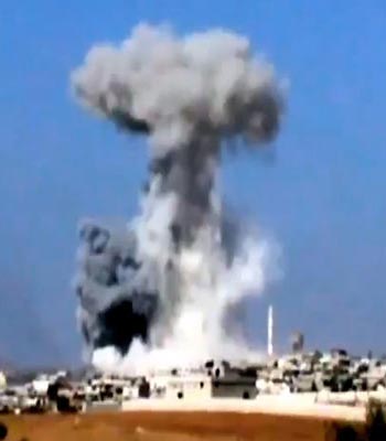 Smoke rising due to heavy bombings from military warplanes, not pictured, in Idlib province, northern Syria. (AP)