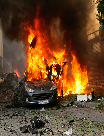 A car burns at the site of an explosion in Ashrafieh, east Beirut, October 19, 2012. (Reuters)