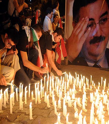 Lebanese mourners light candles during a vigil for Brig. Gen. Wissam al-Hassan and at least seven others who were killed in a Friday bomb attack in Beirut. (AP)