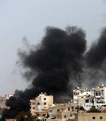 Smoke billows in Tripoli's Bab al-Tabanneh neighbourhood during clashes between Alawites, an offshoot of Shiite Islam and anti-President Bashar al-Assad supporters. (AFP)