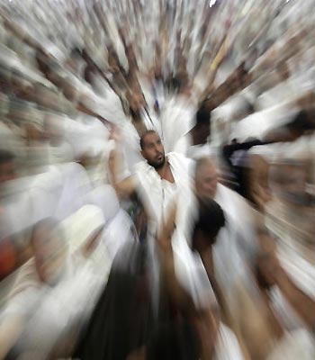 Muslim pilgrims cast stones at a pillar, symbolizing the stoning of Satan, in a ritual called "Jamarat," a rite of the annual hajj, the Islamic faith's most holy pilgrimage, in Mina. (AP)