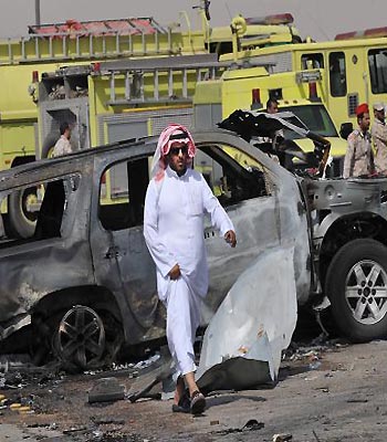 Saudi security forces inspect the destruction at the site where a gas tanker exploded on a main road in the Saudi capital Riyadh. (AFP)