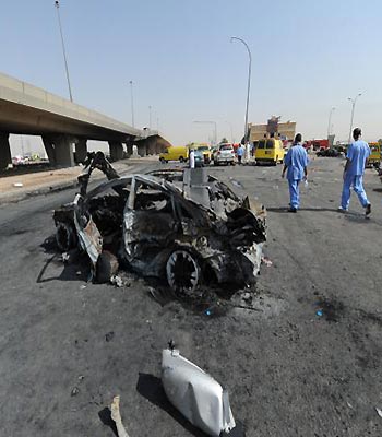 Saudi rescue workers are seen at the site where a truck transporting gas exploded on November 1, 2012 in Riyadh.(AFP)