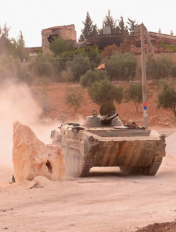 A Syrian army tank is seen in the Khan al-Assal area after clashes between Free Syrian Army fighters and forces loyal to Syria's President Bashar al-Assad, near Aleppo city. (Reuters)