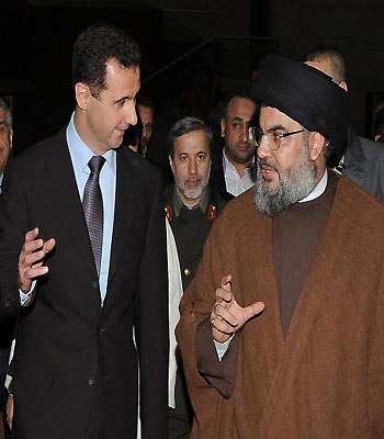 In this 2010 file photo, Hezbollah leader Hassan Nasrallah, speaks with Syrian President Bashar Assad, upon their arrival for a dinner, in Damascus, Syria.(AP)
