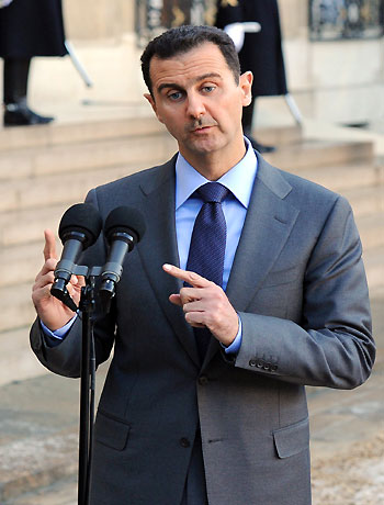 A picture dated on December 9, 2010 shows Syrian president Bashar al-Assad gesturing as he delivers a speech at the Elysee Palace in Paris, after sharing a working lunch with his French counterpart Nicolas Sarkozy (AFP)