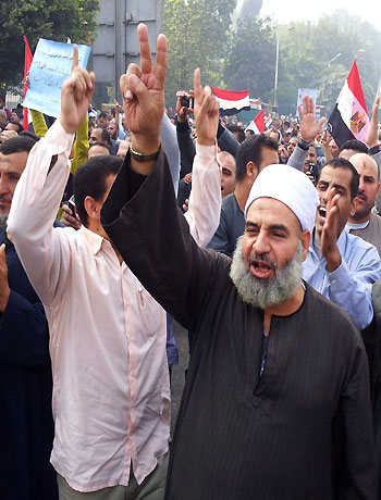 In this image made with a mobile phone camera, supporters of Egyptian President Mohammed Morsi march in Cairo, Egypt, Saturday, Dec. 1, 2012. (AP)