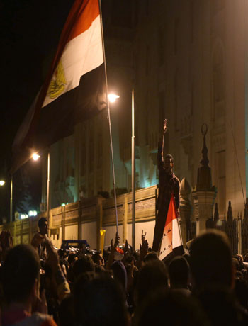 Tens of thousands of anti-Mohamed Morsi protesters gather in front of the presidential palace on December 7, 2012 in Cairo. (AFP)