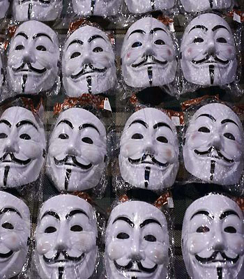 Masks of Guy Fawkes are displayed by a street vendor in the previously sealed off precinct in front of the Egyptian presidential palace in Cairo. (AFP)