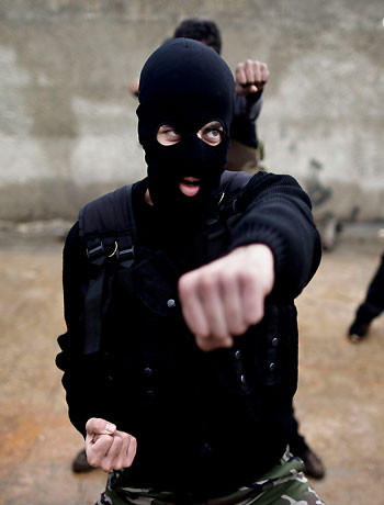 In this Monday, Dec. 17, 2012 photo, Syrian rebels attend a training session in Maaret Ikhwan, near Idlib, Syria. (AP)