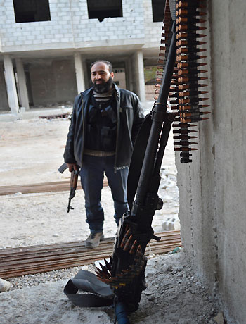 A Free Syrian Army fighter is seen at Zamalka near Damascus December 19, 2012. Picture taken December 19, 2012. (Reuters)