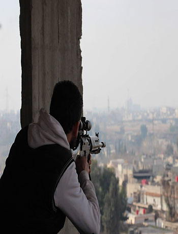 Free Syrian Army fighter is seen in Ain Terma area in Ghouta, east of Damascus December 15, 2012. (Reuters)