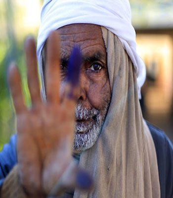 An Egyptian elderly man shows his inked finger after casting his vote in Cairo, Egypt (AP)