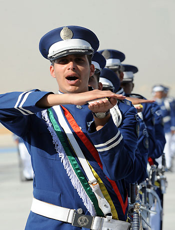 Saudi graduate air force officers performs the loyalty oath on Islam's holy Koran during the graduation ceremony of the 83rd batch of King Faisal Air Academy (KFAA) students held at the Riyadh military airport, on January 1, 2013. (AFP)