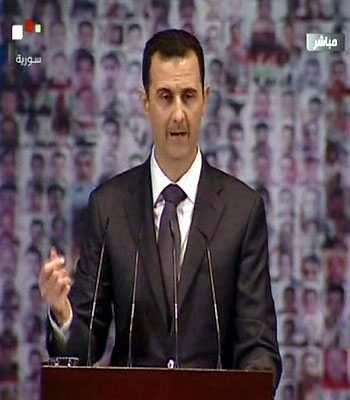 An image grab taken from TV shows Syria's embattled President Bashar al-Assad making a public address on the latest developments in the country and the region on January 6, 2013. (AFP)
