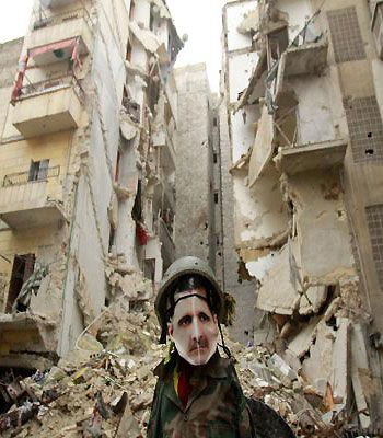 A dummy dressed up in army fatigue and a mask depicting Syrian President Bashar al-Assad is erected in the Salaheddine neighbourhood of Aleppo. (AFP)