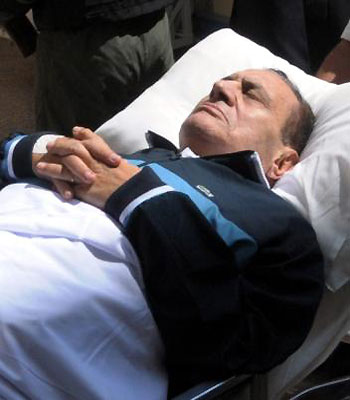 A file photo dated 07 September 2011, shows former Egyptian president Hosni Mubarak on a stretcher while being taken to the courtroom for another session of his trial in Cairo. (EPA)