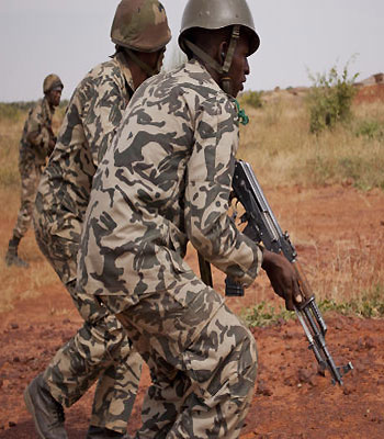 In this Nov. 24, 2012 photo, soldiers from a Malian army run during a training exercise in the Barbe military zone, in Mopti, Mali. (AP)