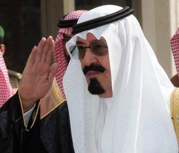 Saudi Arabia's King Abdullah arrives to open the headquarters of International Energy Forum (R)