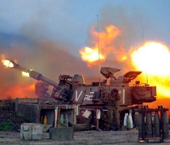 Israeli artillery fires from a base along the northern border with southern Lebanon on Monday (EPA)