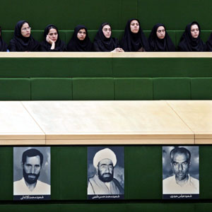 Iranian women, listen to the speeches on nominee for the post of Iran's oil minister, in an open session of the parliament in Tehran, Iran, November 23, 2005 (AP)