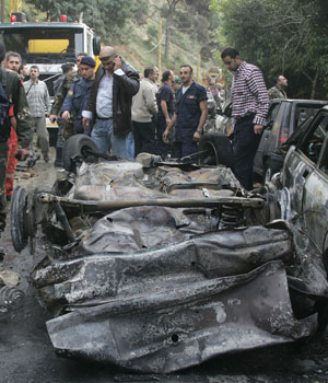 Lebanese security forces inspect the scene of a car bomb explosion in Beirut's Mkalles Christian suburb, which targeted leading journalist and MP Gibran Tueni who was killed immediately, according to eye witnesses, 12 December, 2005 (AFP)