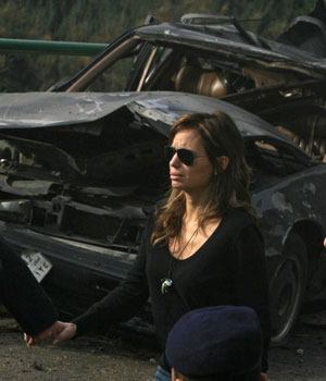 Siham Tueni, widow of slain Lebanese leading anti-Syrian journalist and MP Gebran Tueni, reacts at the site of the bomb explosion that targeted the car of her husband in Beirut's Mkalles Christian suburb, 12 December 2005 (AFP)