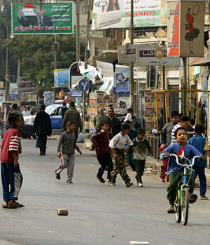 Iraqi children take advantage of the continued security measures to play in an empty street in Baghdad, 16 December 2005, one day after more than two-thirds of Iraqi voters turned out in the election, according to first estimates (AFP)