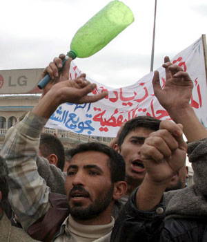 An Iraqi man shouts slogans during a  demonstration demanding the decrease of the petrol price in Tikrit north of Baghdad on Tuesday, 20 December 2005 (EPA)