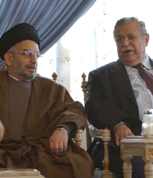Abdel Aziz Hakim, leader of a formerly Iran-based religious party that is one of the main planks of the Shiite United Iraqi Alliance, sits with Iraqi President Jalal Talabani, 29 December 2005, in the northern Kurdish town of Dukan (AFP)