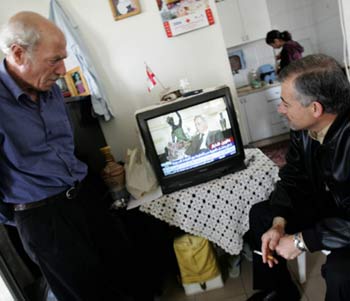 Lebanese men watch Syrian Vice-President Abdel Halim Khaddam in a wide ranging interview with the Dubai-based Al-Arabiya television (AFP)