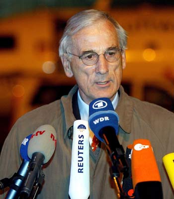 Former German diplomat Juergen Chrobog addresses the press at the Cologne-Bonn airport (EPA)