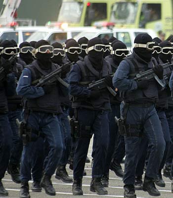 Members of the Saudi Special Forces march in front of Interior Minister Prince Naif in Arafat (R)