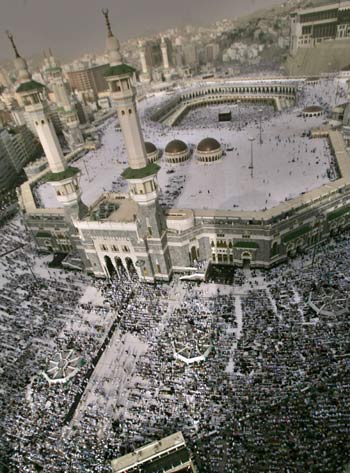 Muslim pilgrims pray inside and outside the Great Mosque in Mecca (AP)