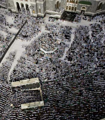 Muslim pilgrims pray inside and outside the Great Mosque in Mecca (AP)
