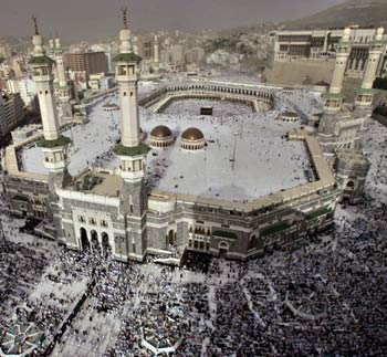 Muslim pilgrims pray inside and outside the Great Mosque in Mecca (AP)