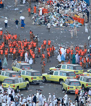 Picture shows medics and security forces gathering at the site where a stampede took place at the eastern entrance of the Jamarat bridge (SPA)