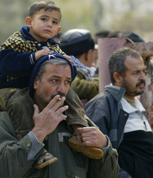 Unemployed Palestinians stage a protest demanding jobs in front of the offices of Palestinian leader Mahmoud Abbas in Gaza City, 18 January 2006 (AFP)