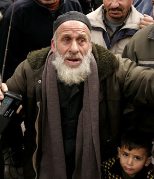 Unemployed Palestinian chants during demonstration in Gaza City calling for jobs, in front of the Parliament building in Gaza City January 18, 2006 (REUTERS)