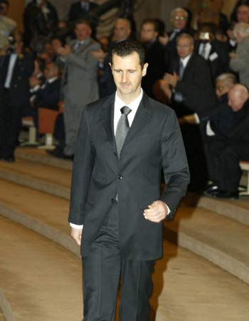 Syrian President Bashar al-Assad prepares to address the 22nd conference of the Union of Arab lawyers held in Damascus (AFP)