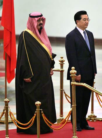 King Abdullah and Chinese President Hu Jintao, listen to their respective national anthems during the Kings welcome ceremony at Beijing's great hall of the people (AP)